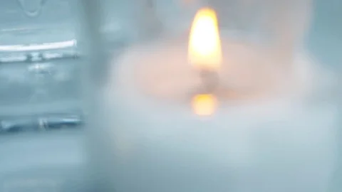 Beautiful candle on the table outside Stock Footage 80106891