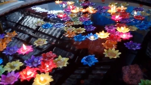 Beautiful candles floating on the pond Stock Footage 105980985
