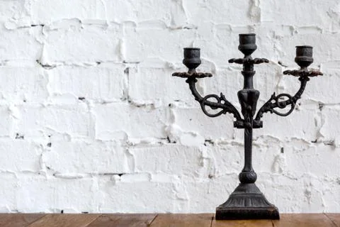 Beautiful candlestick with decorative elements standing in room Foto stock