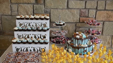 Beautiful candy bar with cakes and candies for birthday Stock Footage 99740353