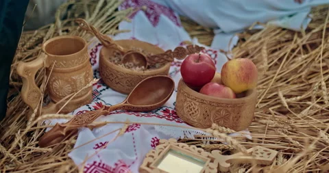 Beautiful carved tableware items lie on an embroidered towel, lunch in the field Stock Footage 211780684