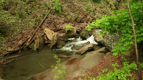 Beautiful cascade through a mountainside Stock Footage 153870806
