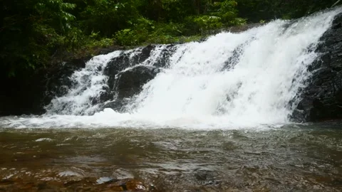 Beautiful Cascade Waterfall in Green Forest. Tropics in Mountain Wild Jungle Видео 143791052
