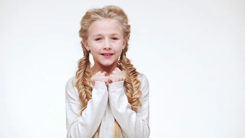Beautiful Caucasian young girl with long blonde hair standing with eyes close Stock Footage
