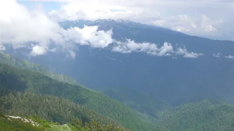 Beautiful Caucasus mountains with running clouds Stock Footage 144441259