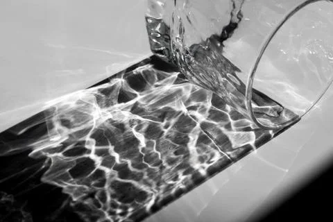 Beautiful caustic effect as light passes through a glass Stock Photos