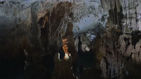 A beautiful cave lit from the inside with stalagtites, in Phong Nha, Vietnam Stock Footage 232436440