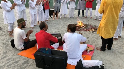 Beautiful ceremony by the fire at sunset on the beach in the holy city Stock-Footage 120323797