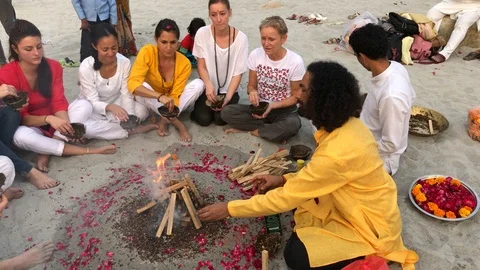 Beautiful ceremony by the fire at sunset on the beach in the holy city Stock-Footage 120325665
