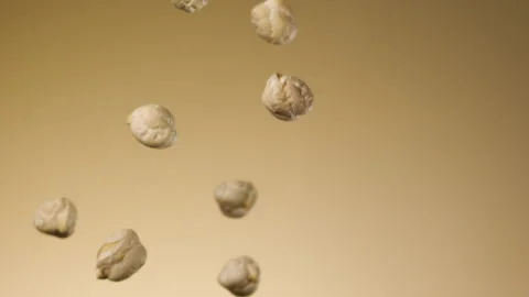 Beautiful chickpeas falling in slow motion Stock Footage 150979467