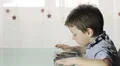 beautiful child plays with the tablet HD Footage
