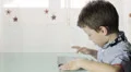 beautiful child surf the internet with your tablet HD Footage