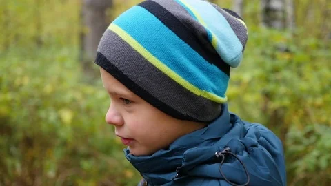 Beautiful child walking on the alley in autumn Park. Outdoor Activities. Autumn Stock Footage