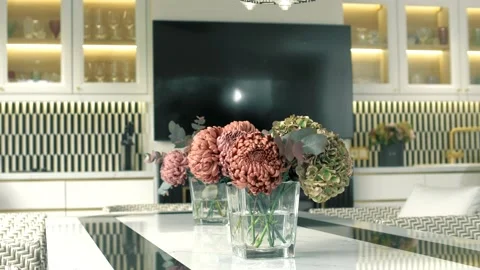Beautiful Chinese asters on a marble table in a modern kitchen Stock Footage 165988070