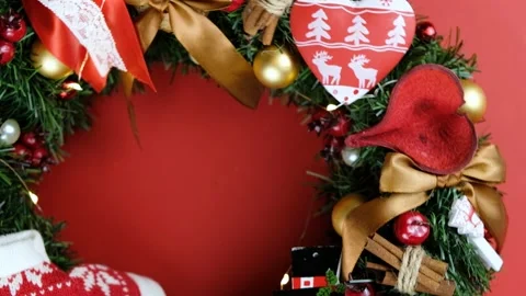 Beautiful Christmas hand made rustic wreath on red background. Made with pine Stock Footage 144851595