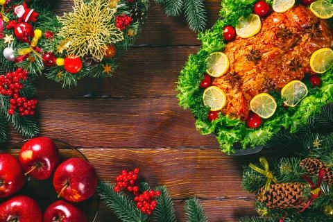 Beautiful Christmas table dinner time with roasted meats decorated in Christm Stock Photos