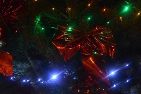 Beautiful Christmas tree, natural pine with red, blue, green and yellow bulbs Stock Photos