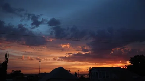 Beautiful cinematic cloudscape time lapse, rainy clouds moving in warm summer ev Stock Footage 161370435