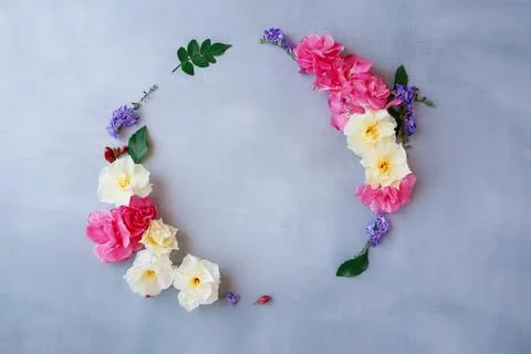 Beautiful circle shaped,Frame composition,various fresh flowers on grey Stock Photos