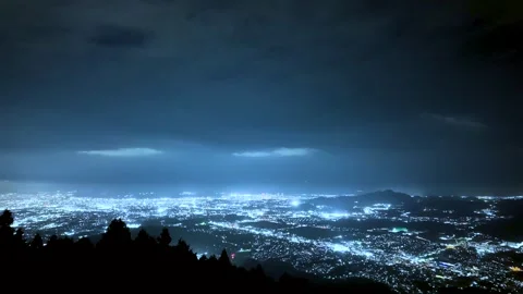 Beautiful City Lights and Cloud Motion Timelapse at Night Stock Footage 336489019