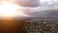 The beautiful city on the sunset background. quadrocopter shot. time lapse 4k or 4k+ Resolution
