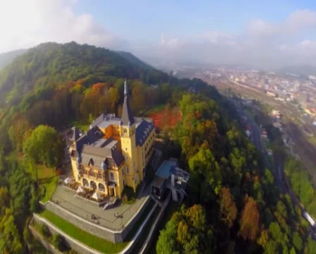 Beautiful city town castle, yellow building aerial fly around, click for HD Stock Footage 43909953