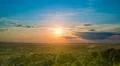 The beautiful city view on the background of sunset. Wide angle Photo