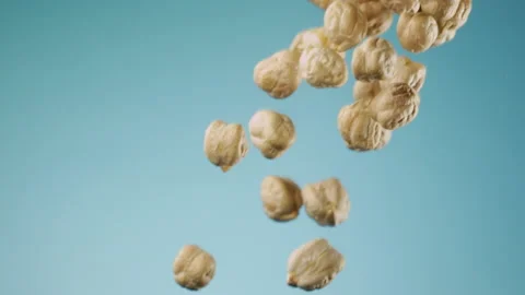 Beautiful ckickpeas falling in slow motion Stock Footage 151040547