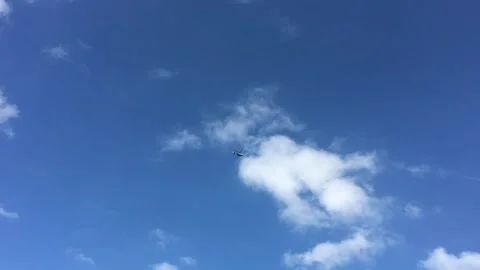 A Beautiful Clear Blue Sky Decorated with Fluffy White Clouds is Truly Stock Footage 307351162