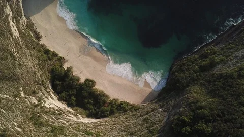Beautiful Cliffs and White Sandy Beach from Above [Drone Footage] Stock Footage 96286483