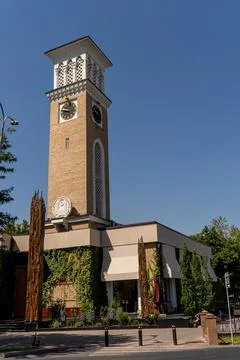 Beautiful clock tower complex. Uzbekistan, copy space for text, blue sky Stock Photos