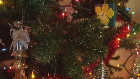 Beautiful close-up of Christmas tree branches with ornaments and lights 動画素材 84919787