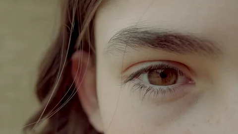 Beautiful close up of eye slowly blinking, 2 colour grades - Sepia/Moody blue Stock Footage 88306742