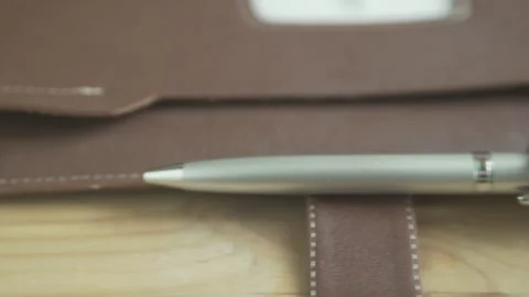 Beautiful close up shot of light brown leather case note pad book journal with s Stockbeeldmateriaal 137538609