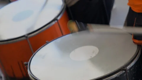 Beautiful close up of two drummers as they beat the drums in a high speed displa Stock Footage 127892865