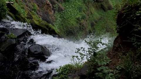Beautiful close up of water falling down a steep slope creating a beautiful Stock-Footage 245782257