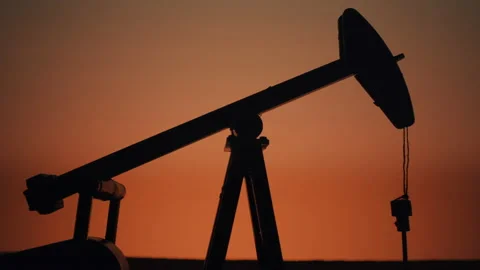 Beautiful close up of a working oil pump with an orange sunset sky, pump-jack 4k Stock Footage 164541026