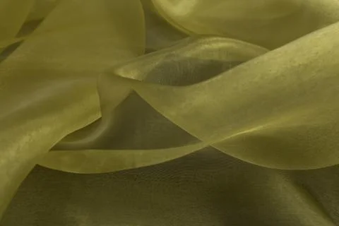 Beautiful close up of yellow silk fabric with textile texture background Stock Photos