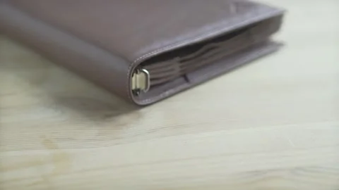 Beautiful closed brown leather case holder note pad book bullet journal habit tr Stockbeeldmateriaal 137538839