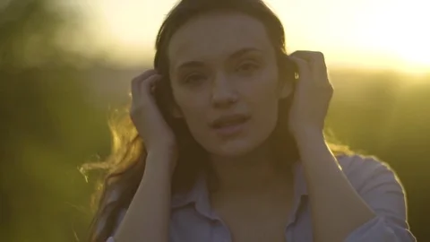 Beautiful Closeup Of Mixed Race Model Posing, Brushing Her Hair Back, At Sunset Stock Footage 76011760