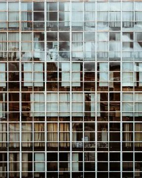 Beautiful closeup shot of an old library with square white windows Stock Photos