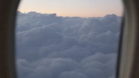 Beautiful cloud and wing of airplane from window with a nice blue sky Stock Footage 131264268