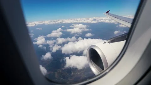 Beautiful cloud and wing of airplane from window Stock Footage 228682592
