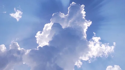 A beautiful cloud covered the sun. Sun rays around the clouds. Stock Footage 83569549