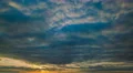 The beautiful cloud flow against the background of sunset. Time lapse 4k or 4k+ Resolution