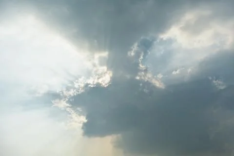 Beautiful cloud formation with rays of sun coming out from the clouds Stock Photos