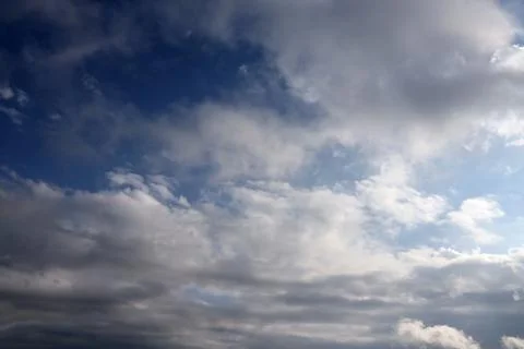 Beautiful cloud formations in the sky with sunlight behind. White clouds on.. Fotos Stock