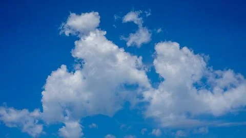 Beautiful Cloud Patterns Against a Clear Blue Sky Background Stock Photos