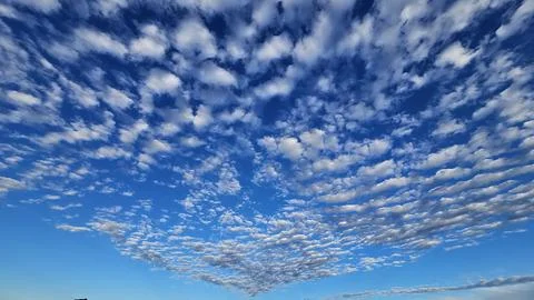 Beautiful cloud patterns formed in a summer afternoon Stock Photos