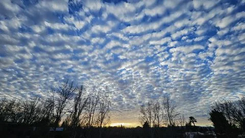 Beautiful cloud patterns formed in a summer afternoon Stock Photos